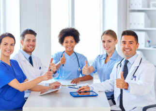 group of professionals doing thumbs up