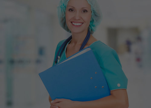 medical staff smiling while bringing a folder